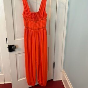 Free People Livin Lovely smocked cotton crepe jumpsuit NWT audacious (orange) xs